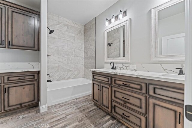 21813 Valley Vista Dr, Tehachapi, CA 93561 - bathroom with double vanity, bathtub / shower combination, and wood finished floors