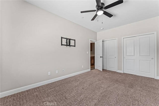 21813 Valley Vista Dr, Tehachapi, CA 93561 - unfurnished bedroom with carpet, multiple closets, and a ceiling fan
