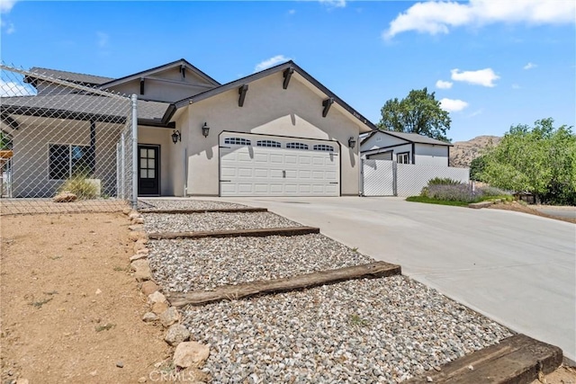 21813 Valley Vista Dr, Tehachapi, CA 93561 - view of front of property featuring driveway, an attached garage, and stucco siding