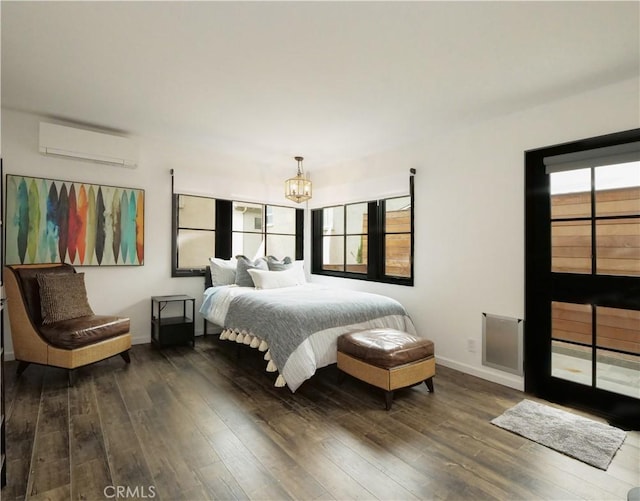 229 Marine Pl, Manhattan Beach, CA 90266 - bedroom with a wall mounted AC, dark wood-style floors, and a chandelier