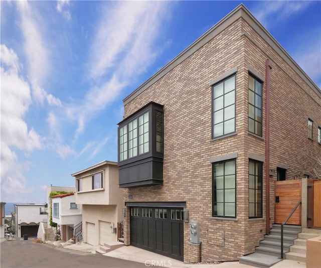 229 Marine Pl, Manhattan Beach, CA 90266 - view of building exterior with an attached garage