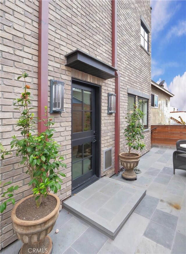 229 Marine Pl, Manhattan Beach, CA 90266 - entrance to property with a patio and brick siding