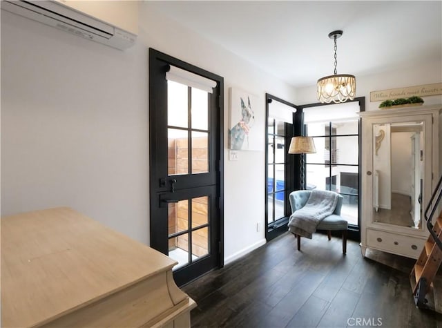 229 Marine Pl, Manhattan Beach, CA 90266 - living area with a wall mounted AC, healthy amount of natural light, dark wood-style flooring, and a chandelier
