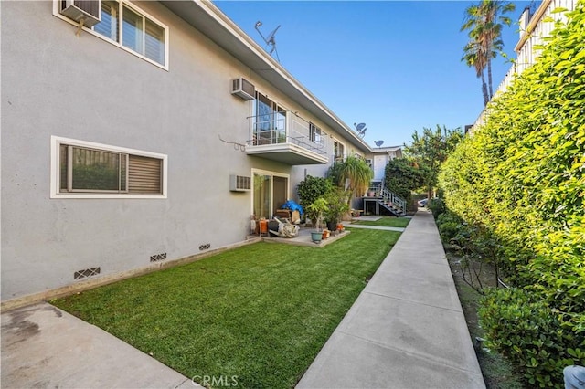 418 E Harvard Rd Unit D, Burbank, CA 91501 - view of grassy yard with a wall mounted AC, an AC wall unit, and a patio