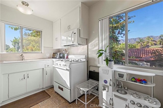 418 E Harvard Rd Unit D, Burbank, CA 91501 - kitchen with white appliances, light countertops, and white cabinets