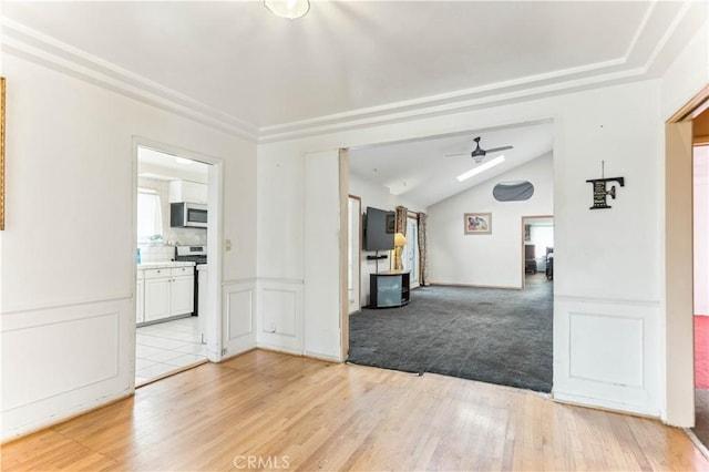 4519 9th Ave, Los Angeles, CA 90043 - unfurnished living room with a ceiling fan, light wood-style flooring, and vaulted ceiling