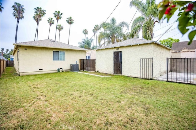 4519 9th Ave, Los Angeles, CA 90043 - rear view of property with stucco siding, a fenced backyard, and a gate