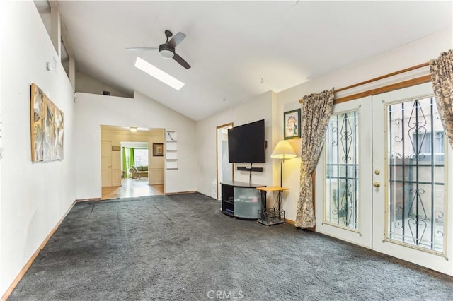 4519 9th Ave, Los Angeles, CA 90043 - unfurnished living room featuring french doors, carpet, a skylight, a ceiling fan, and high vaulted ceiling