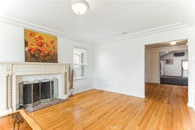 4519 9th Ave, Los Angeles, CA 90043 - unfurnished living room with light wood finished floors, a fireplace with flush hearth, and ornamental molding