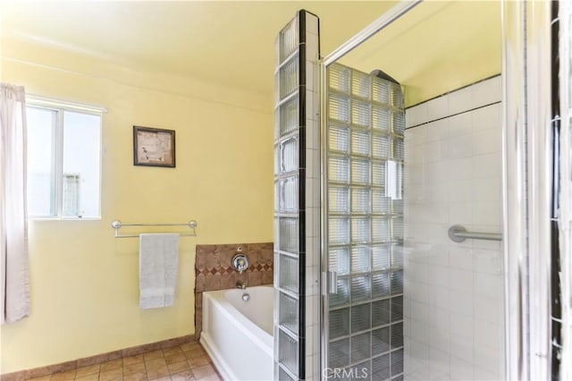 4519 9th Ave, Los Angeles, CA 90043 - full bathroom with a bath, a shower stall, and tile patterned floors
