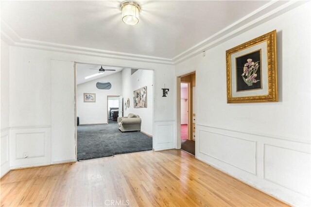 4519 9th Ave, Los Angeles, CA 90043 - spare room with lofted ceiling, ceiling fan, light wood-type flooring, wainscoting, and a decorative wall