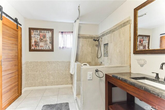 4519 9th Ave, Los Angeles, CA 90043 - bathroom with a tile shower, tile patterned flooring, and vanity