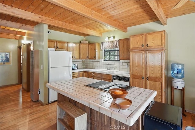 2229 Birchwood Way, Pine Mountain Club, CA 93222 - kitchen with white appliances, tile countertops, a wooden ceiling with exposed beams, light wood-type flooring, and decorative backsplash