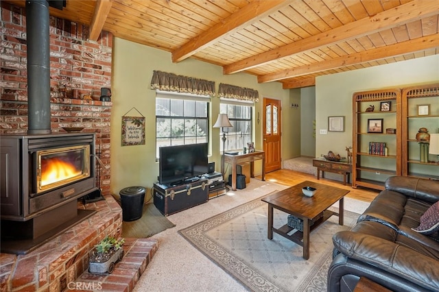 2229 Birchwood Way, Pine Mountain Club, CA 93222 - living area with a wood stove, a wood ceiling with exposed beams, and carpet flooring