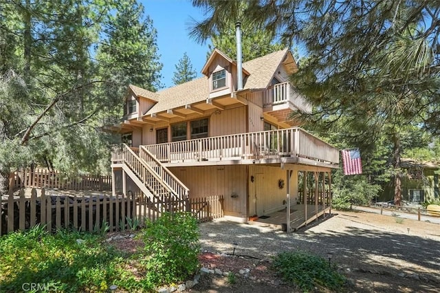 2229 Birchwood Way, Pine Mountain Club, CA 93222 - rear view of property featuring roof with shingles, a balcony, stairs, and a deck