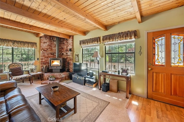 2229 Birchwood Way, Pine Mountain Club, CA 93222 - living area featuring a wood stove, plenty of natural light, a wood ceiling with exposed beams, and wood finished floors