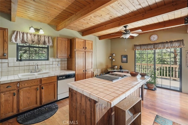 2229 Birchwood Way, Pine Mountain Club, CA 93222 - kitchen with dishwasher, tile counters, light wood-style flooring, healthy amount of natural light, and a wood ceiling with exposed beams