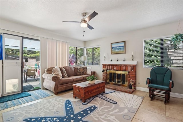 22024 Jeffers Ln, Saugus, CA 91350 - living room with ceiling fan, a brick fireplace, light tile patterned flooring, and a textured ceiling