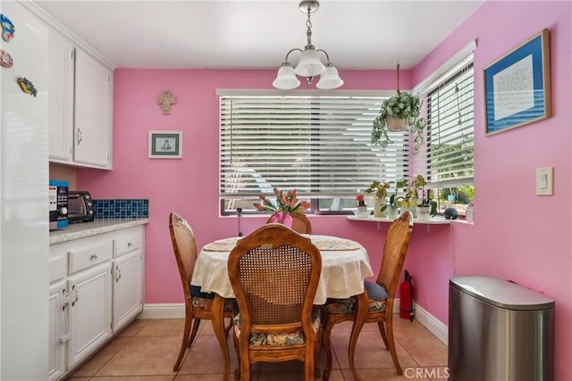 22024 Jeffers Ln, Saugus, CA 91350 - dining room featuring light tile patterned floors and a chandelier