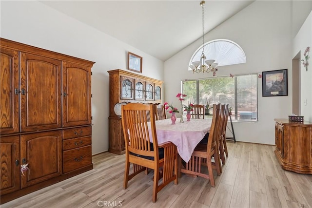 22024 Jeffers Ln, Saugus, CA 91350 - dining room featuring a chandelier, high vaulted ceiling, and light wood finished floors