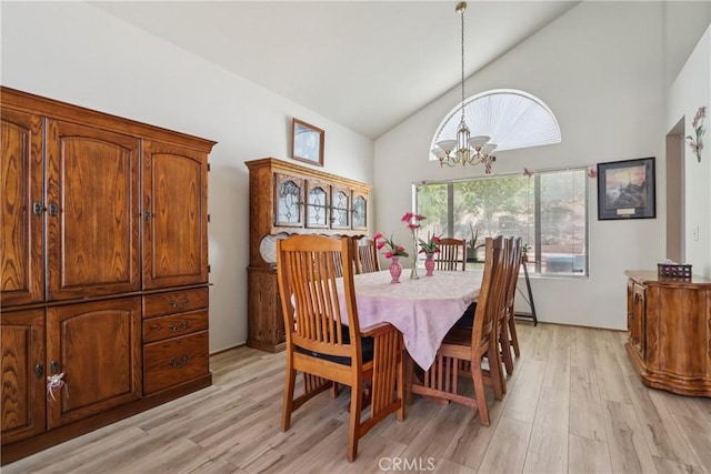22024 Jeffers Ln, Saugus, CA 91350 - dining space with a chandelier, light wood-style flooring, and high vaulted ceiling