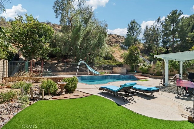 22024 Jeffers Ln, Saugus, CA 91350 - view of pool featuring a water slide and a patio area