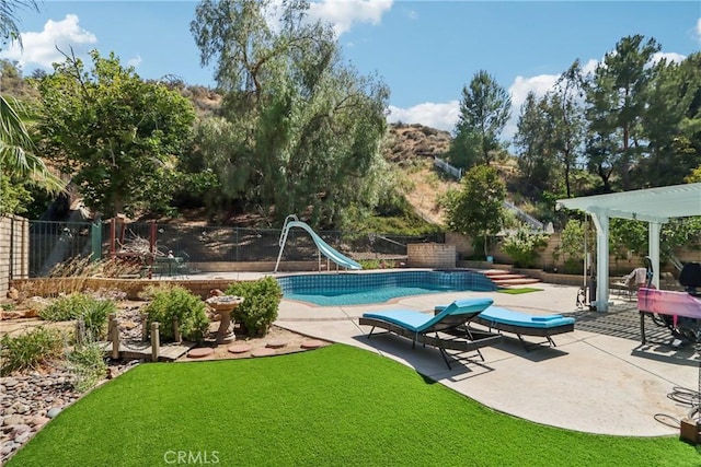 22024 Jeffers Ln, Saugus, CA 91350 - view of swimming pool with a water slide and a patio