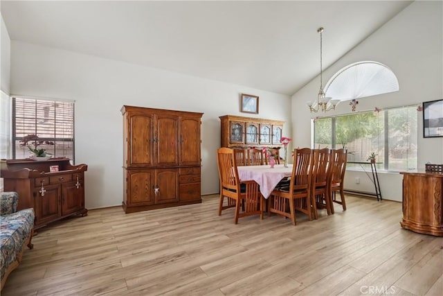 22024 Jeffers Ln, Saugus, CA 91350 - dining space featuring a chandelier, light wood-style flooring, and high vaulted ceiling