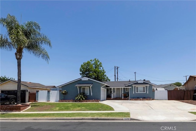 14913 San Ardo Dr, La Mirada, CA 90638 - ranch-style home with a garage, driveway, stucco siding, and a gate
