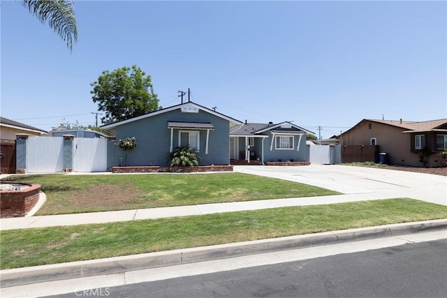 14913 San Ardo Dr, La Mirada, CA 90638 - view of front facade with concrete driveway and stucco siding