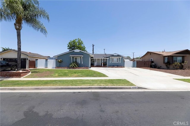 14913 San Ardo Dr, La Mirada, CA 90638 - single story home featuring concrete driveway, stucco siding, a garage, and a gate