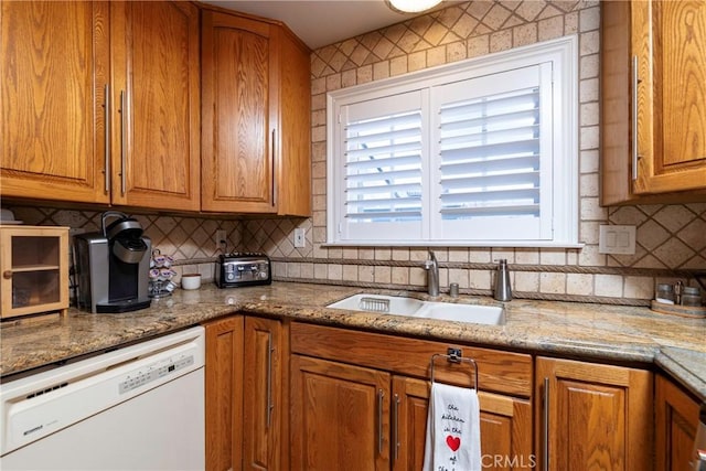 14913 San Ardo Dr, La Mirada, CA 90638 - kitchen with dishwasher, tasteful backsplash, brown cabinets, and light stone countertops