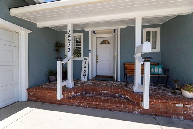 14913 San Ardo Dr, La Mirada, CA 90638 - property entrance with stucco siding and covered porch