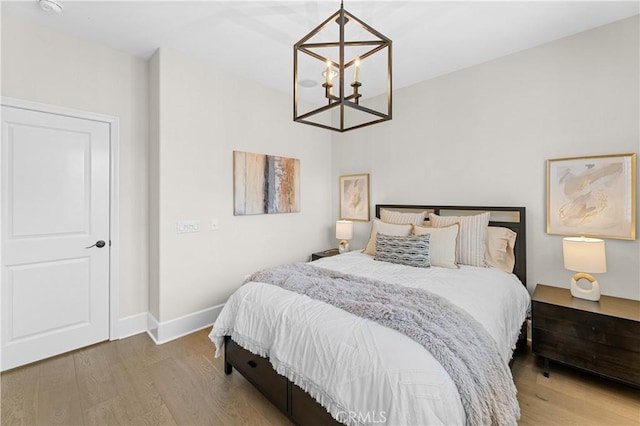 129 Pathway, Irvine, CA 92618 - bedroom featuring a chandelier and wood finished floors