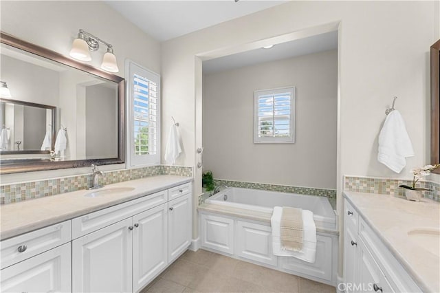 129 Pathway, Irvine, CA 92618 - bathroom with backsplash, two vanities, and a bath