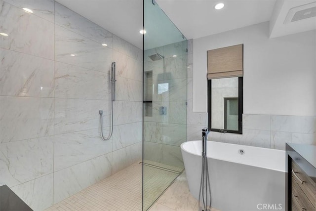 802 Bard St, Hermosa Beach, CA 90254 - bathroom with a freestanding bath, a walk in shower, tile walls, and vanity