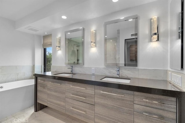 802 Bard St, Hermosa Beach, CA 90254 - full bath featuring a soaking tub, double vanity, and marble look tile flooring