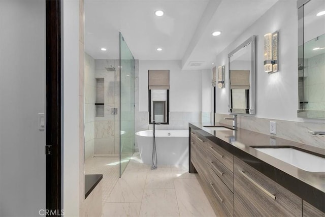 802 Bard St, Hermosa Beach, CA 90254 - full bathroom featuring a freestanding bath, double vanity, a tile shower, marble look tiles, and recessed lighting