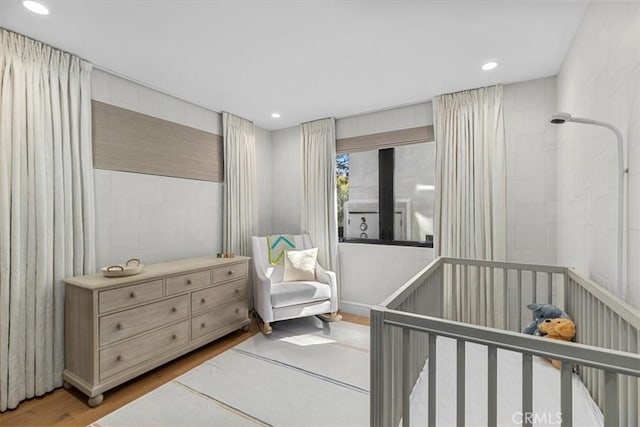 802 Bard St, Hermosa Beach, CA 90254 - bedroom with wood finished floors, recessed lighting, and a crib