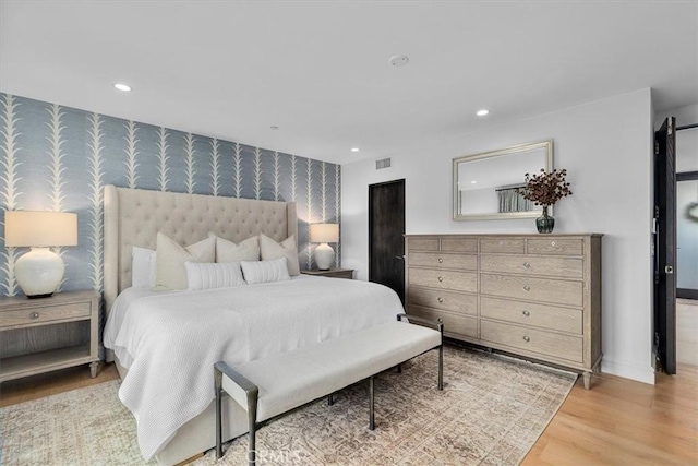 802 Bard St, Hermosa Beach, CA 90254 - bedroom featuring wallpapered walls, an accent wall, recessed lighting, and light wood-style flooring