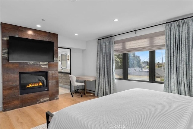 802 Bard St, Hermosa Beach, CA 90254 - bedroom with wood finished floors, a tiled fireplace, and recessed lighting