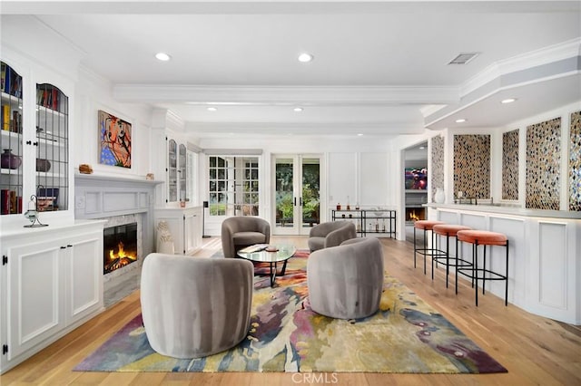 29614 Ridgeway Dr, Agoura Hills, CA 91301 - living room featuring a premium fireplace, crown molding, light wood-style floors, french doors, and recessed lighting