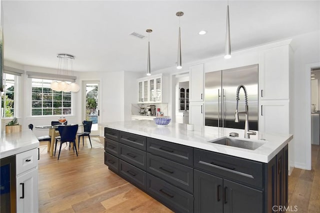 29614 Ridgeway Dr, Agoura Hills, CA 91301 - kitchen featuring stainless steel built in refrigerator, white cabinetry, light countertops, and recessed lighting