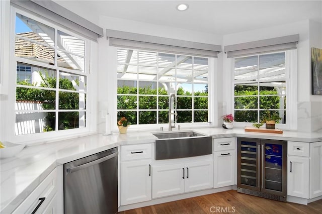 29614 Ridgeway Dr, Agoura Hills, CA 91301 - kitchen with dishwasher, wine cooler, white cabinetry, wood finished floors, and light stone counters