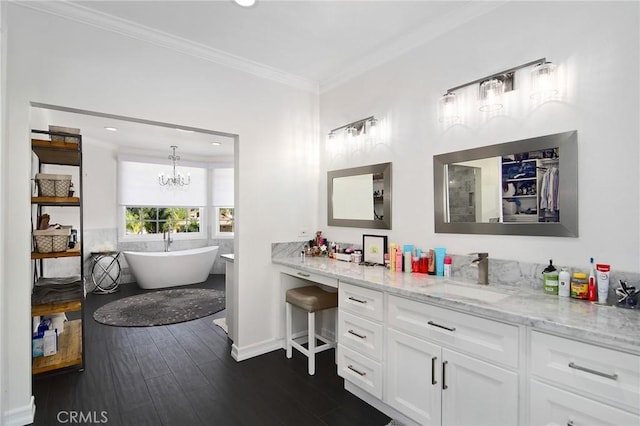 29614 Ridgeway Dr, Agoura Hills, CA 91301 - full bathroom featuring vanity, wood finished floors, crown molding, a freestanding tub, and a chandelier