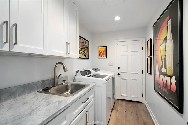 29614 Ridgeway Dr, Agoura Hills, CA 91301 - laundry room featuring cabinet space, separate washer and dryer, light wood-type flooring, and recessed lighting