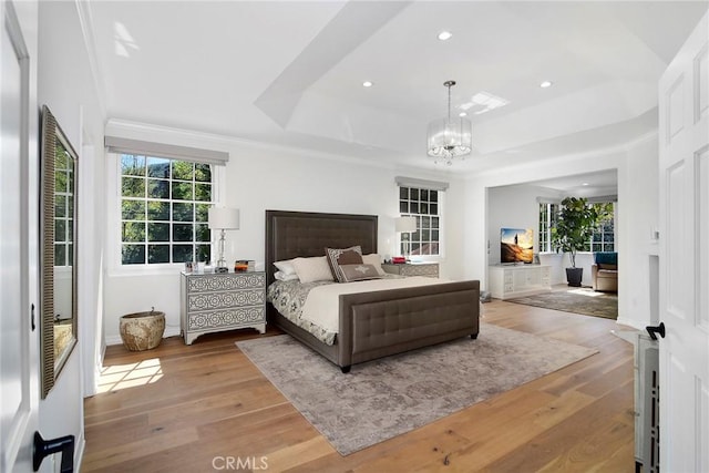 29614 Ridgeway Dr, Agoura Hills, CA 91301 - bedroom with a chandelier, a tray ceiling, wood-type flooring, recessed lighting, and ornamental molding