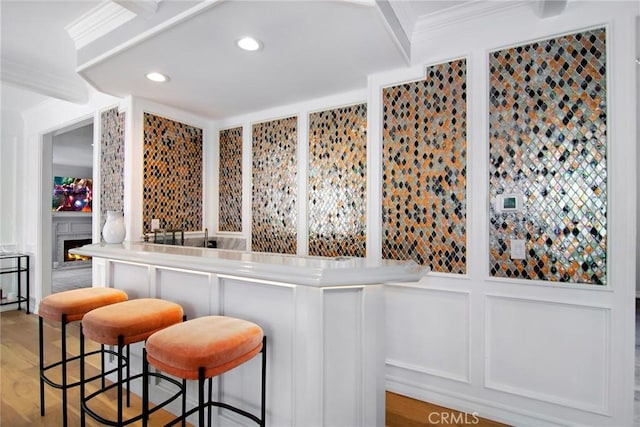29614 Ridgeway Dr, Agoura Hills, CA 91301 - indoor bar featuring crown molding, recessed lighting, a decorative wall, and light wood-style floors