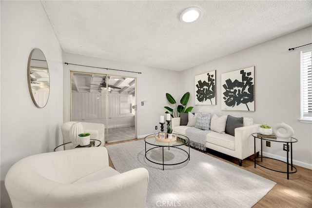 350 E Olive Ave, La Habra, CA 90631 - living area with wood finished floors, a textured ceiling, and a ceiling fan