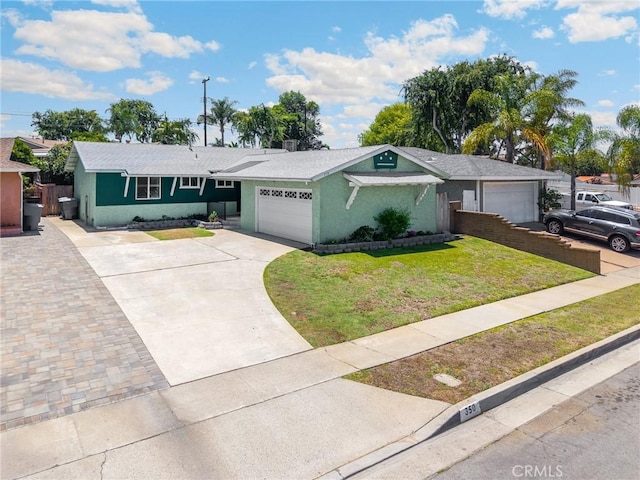 350 E Olive Ave, La Habra, CA 90631 - single story home featuring a garage, a front lawn, stucco siding, and driveway